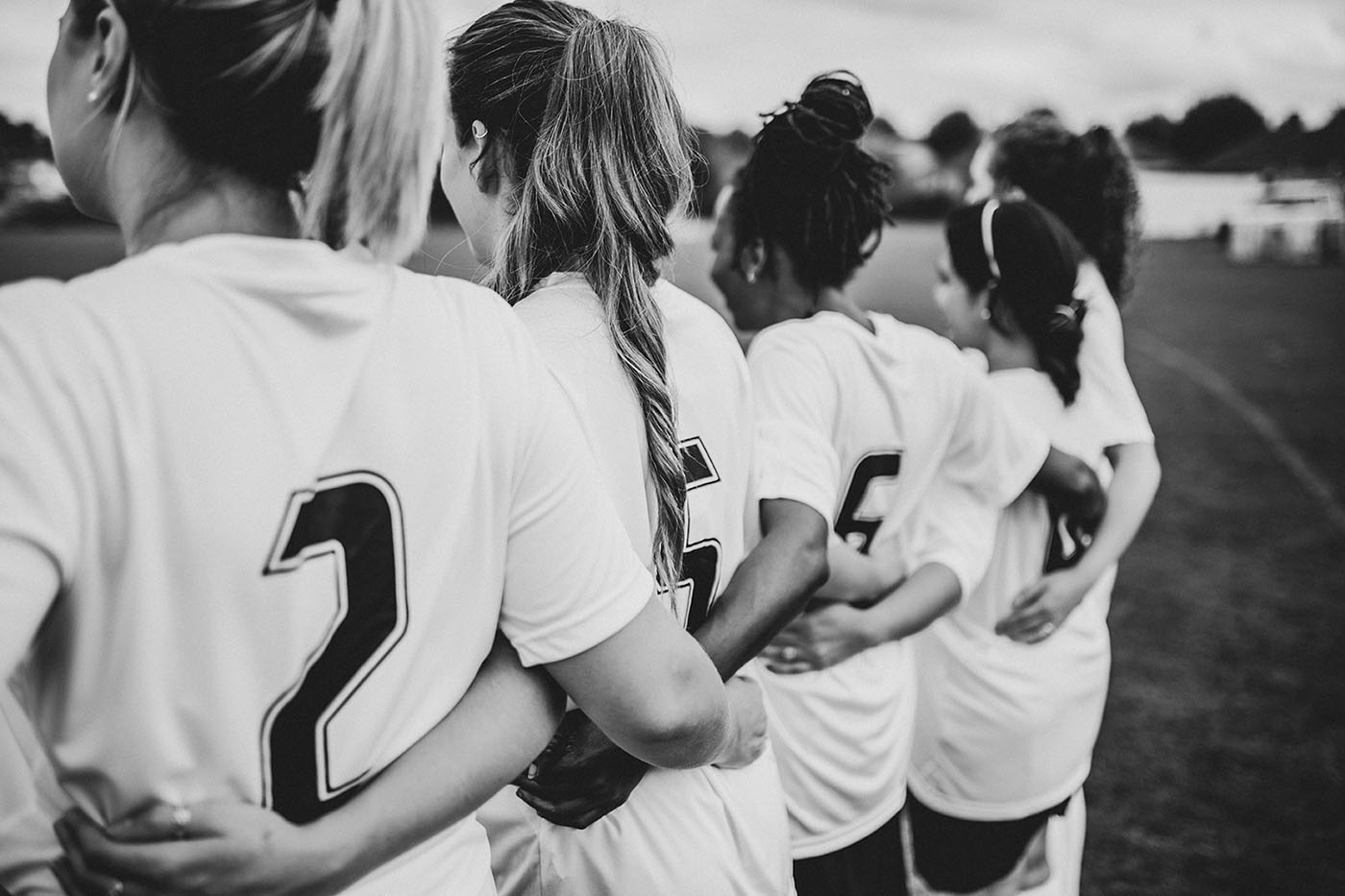 Head for Change | Education - Female,Football,Players,Huddling,Together
