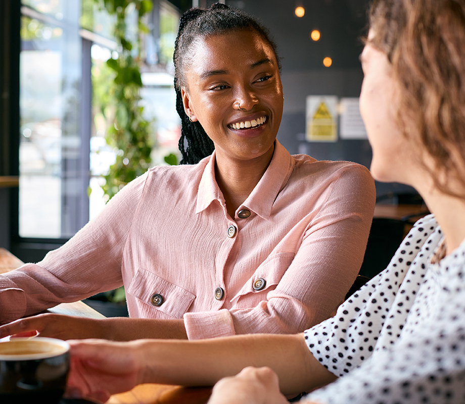 Head for Change | Research - Two,Young,Female,Friends,Meeting,In,Coffee,Shop,And,Talking